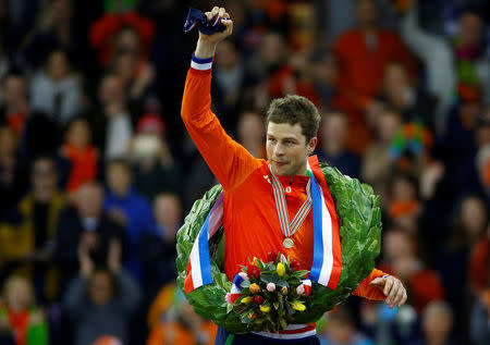 FILE PHOTO: Speed Skating - ISU European Speed Skating Championships All Round medal ceremony- Heerenveen, the Netherlands - 8/1/17 Gold medal winner Sven Kramer of the Netherlands reacts on the podium. REUTERS/Michael Kooren/File Photo