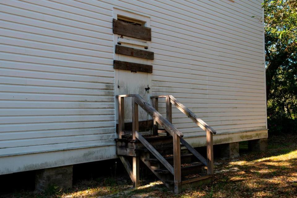 Doors and windows are boarded up at the Quarles House. Even if the renovation goes forward, the building will be able to handle only small events, because it doesn’t have a catering kitchen or much room for parking.