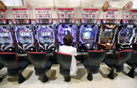 A visitor plays pachinko, a Japanese form of legal gambling, at a pachinko parlour in Fukushima, Japan, May 24, 2018. Picture taken May 24, 2018. REUTERS/Issei Kato