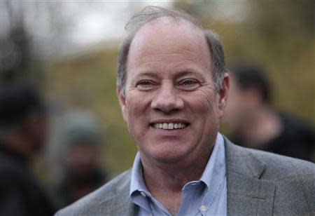 Detroit mayoral candidate Mike Duggan makes a campaign stop in the neighborhood he lived in as a child in Detroit, Michigan November 2, 2013. REUTERS/Rebecca Cook