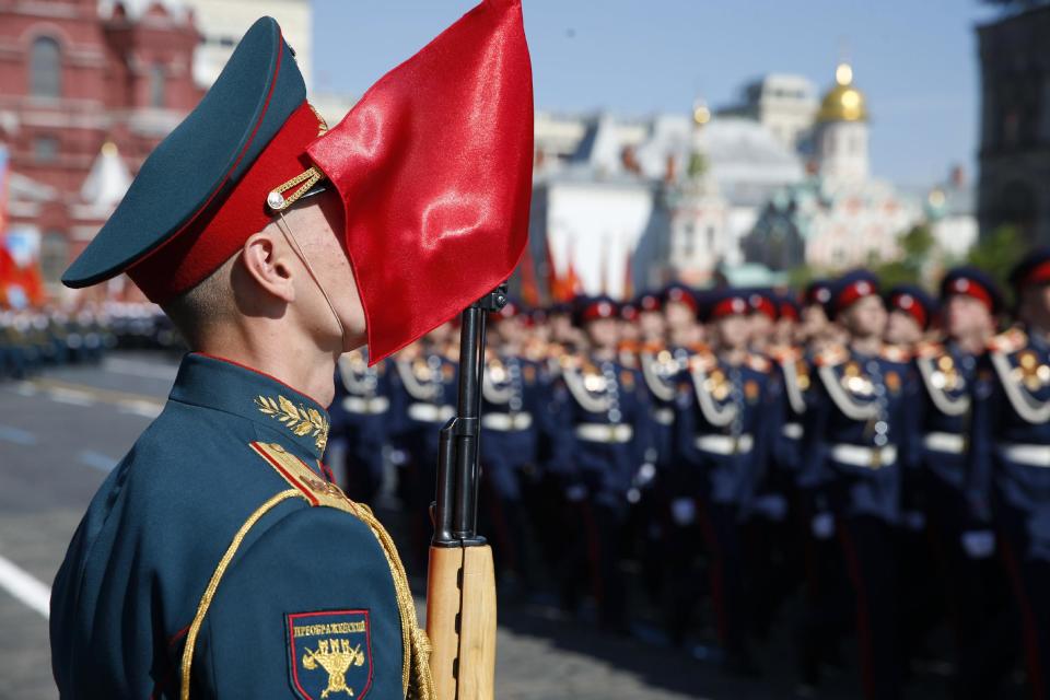 Russian troops march during a Victory Day parade, which commemorates the 1945 defeat of Nazi Germany, at Red Square in Moscow, Russia, Friday, May 9, 2014. Russia marked the Victory Day on May 9 holding a military parade at Red Square. (AP Photo/Pavel Golovkin)