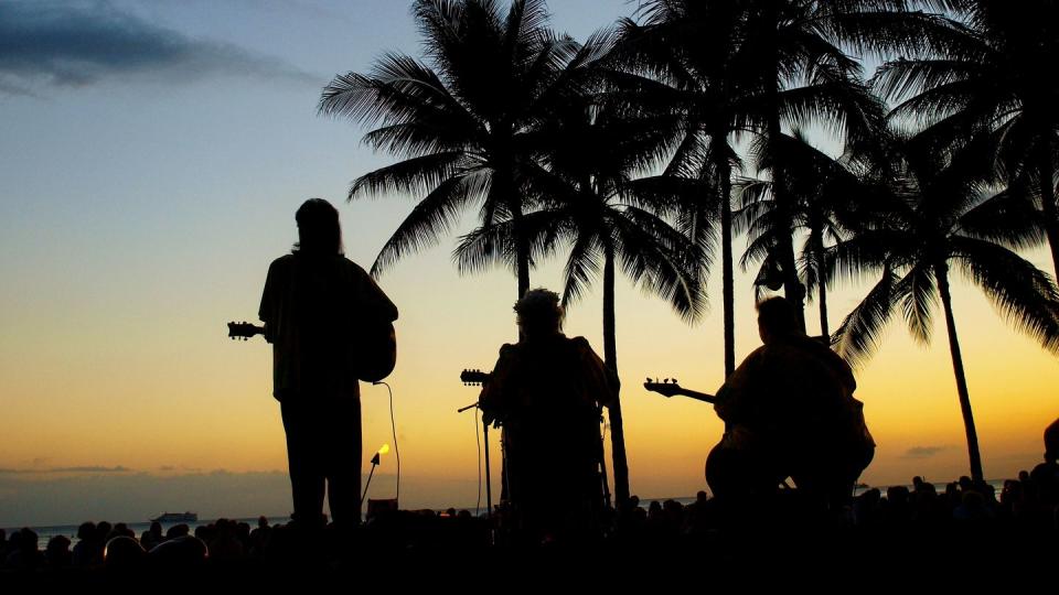 hawaiian music band under palm trees sunset