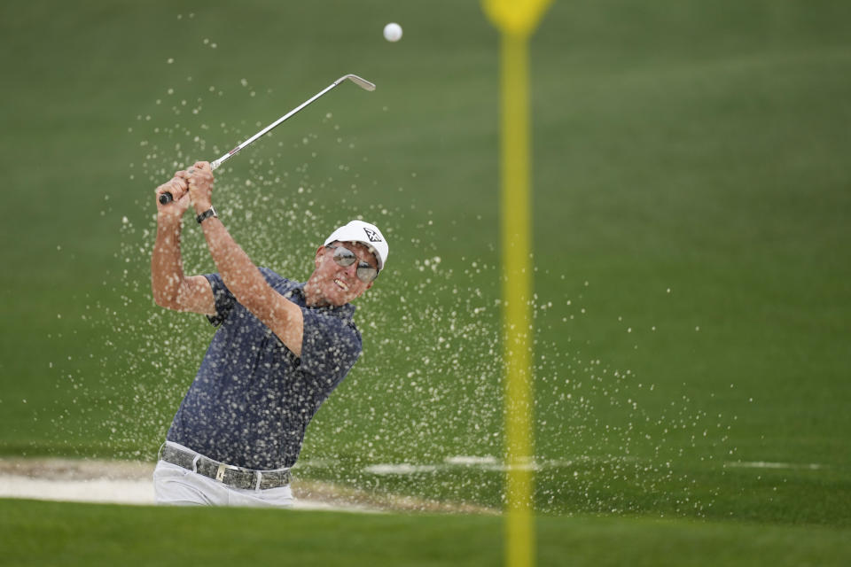 Phil Mickelson hits from the bunker on the second hole during the second round of the Masters golf tournament at Augusta National Golf Club on Friday, April 7, 2023, in Augusta, Ga. (AP Photo/David J. Phillip)