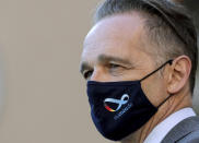 German Foreign Minister Heiko Maas, wears a face mask as he waits for the arrival of China's Foreign Minister Wang Yi for a meeting in Berlin, Germany, Tuesday, Sept. 1, 2020. (AP Photo/Michael Sohn, pool)