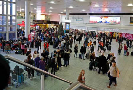 Passengers wait around in the South Terminal building at Gatwick Airport after drones flying illegally over the airfield forced the closure of the airport, in Gatwick, Britain, December 20, 2018. REUTERS/Peter Nicholls