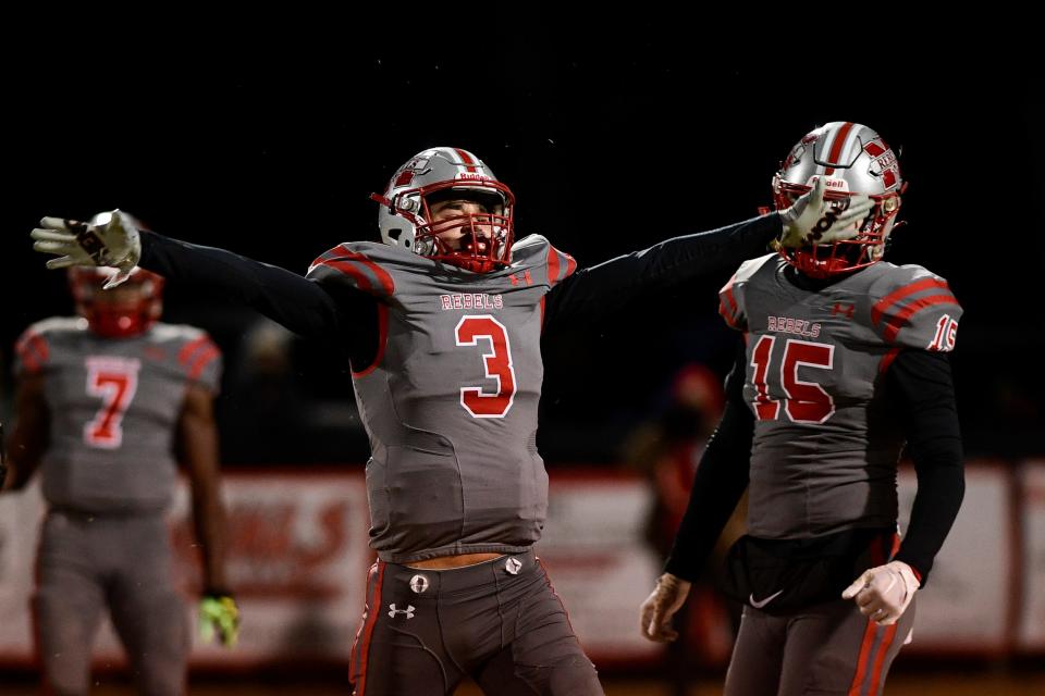 McKenzie’s Zach Aird (3) celebrates after the team made a stop during the playoff game between McKenzie High School and Fayetteville on  Nov. 18. McKenzie beat MASE in the Class 1A semifinals and will play for the state title next week.