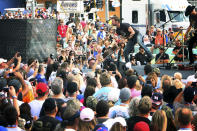 FILE - Country singer Dierks Bentley performs a concert before the NASCAR Sprint Cub Series auto race in Homestead, Fla., Sunday, Nov. 17, 2013. NASCAR has built itself around its traveling show, every weekend a super-charged event of concerts, camping and infield carousing that closes with a Cup race. The party has been canceled during the pandemic but the playoffs go on, starting Sunday, Sept. 6, 2020, without any of the pomp and circumstance. (AP Photo/J Pat Carter, File)