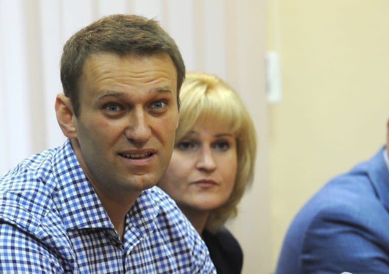 Russian opposition leader Alexei Navalny sits in a courtroom in Kirov, northern Russia on July 18, 2013. The court on Thursday sentenced Navalny to five years in a penal colony after finding him guilty of embezzlement in a timber deal