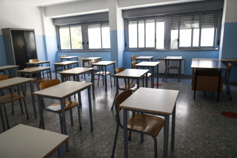 The new single desks that substituted the old ones, to guarantee a safe distance for the start of the new school year, are seen at the Isacco Newton high school institute in Rome Wednesday, Aug. 26, 2020. (Cecilia FabianoLaPresse via AP)