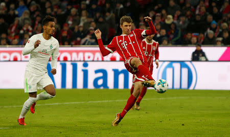 Soccer Football - Bundesliga - Bayern Munich vs Werder Bremen - Allianz Arena, Munich, Germany - January 21, 2018. Bayern Munich's Thomas Muller scores their fourth goal. REUTERS/Michaela Rehle