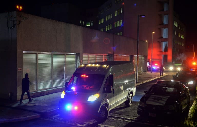 An ambulance carrying Leyva's remains drives away from Adolfo Lopez Meteos Medical Center in Toluca, Mexico, on November 18, 2018