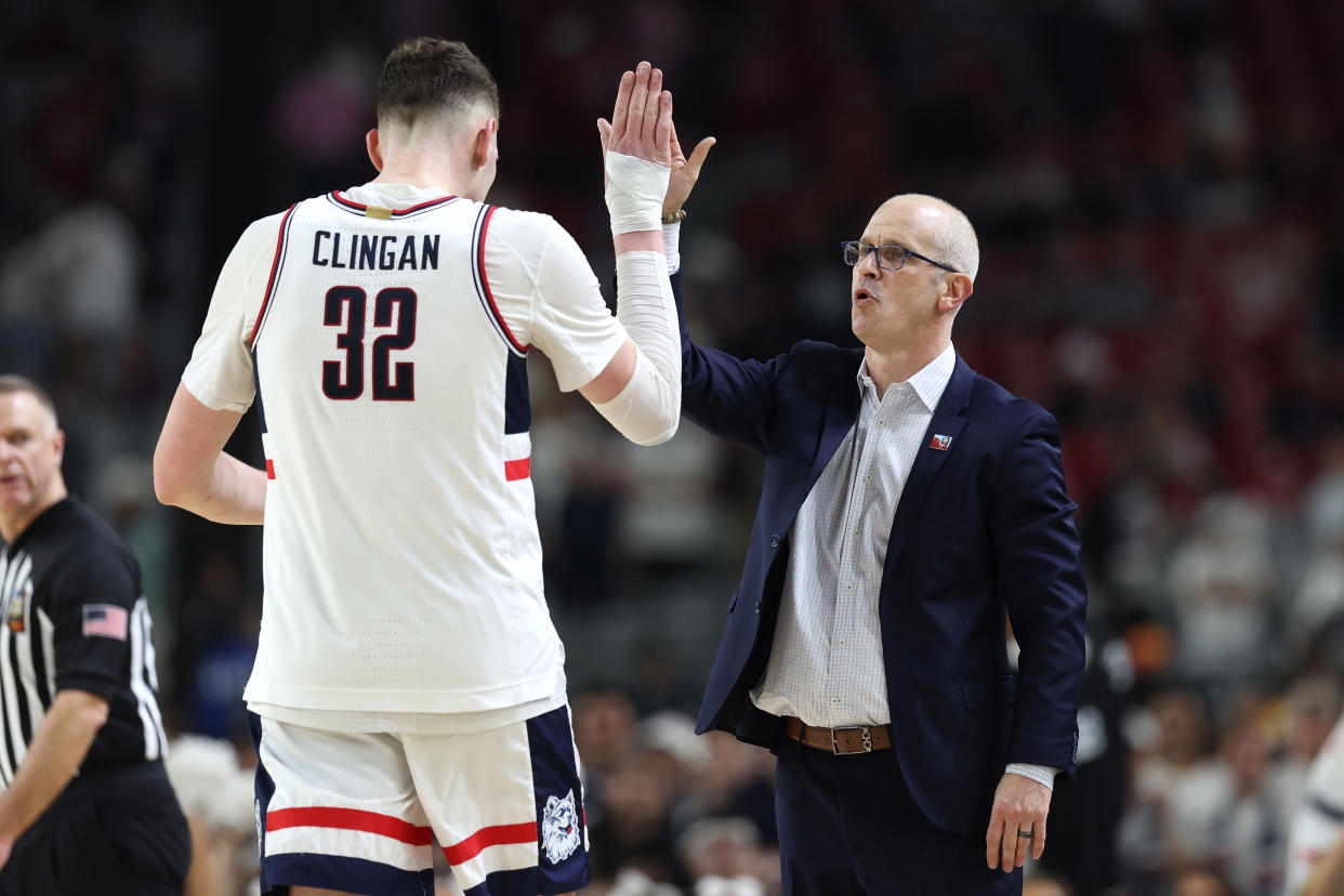Donovan Clingan and UConn coach Dan Hurley celebrate during a national semifinal win over Alabama. (Photo by Jamie Squire/Getty Images)