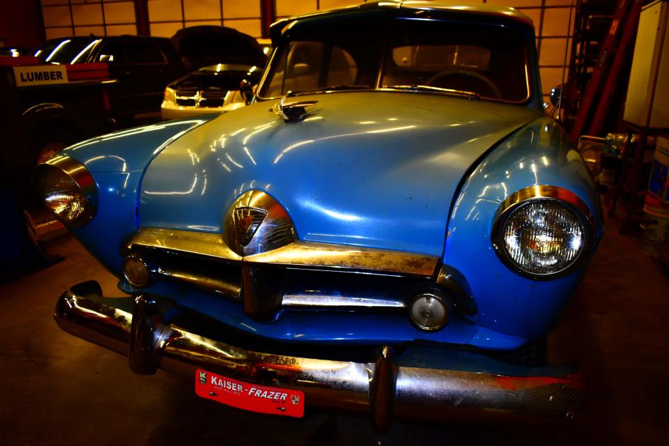 Special effects lighting makes this 1953 Kaiser Henry J appear like new.