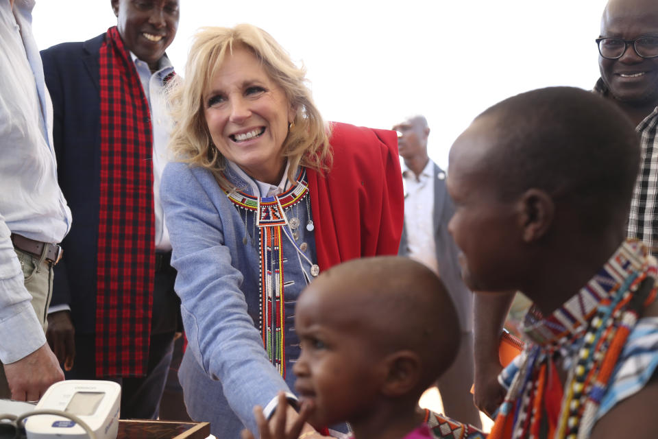 FILE - First lady Jill Biden, left, greets women of the Maasai community as they explain the drought situation in Ngatataek, Kajiado Central, Kenya, Feb. 26, 2023. Vice President Kamala Harris will be the latest and most high-profile administration official to visit Africa this year as the U.S. deepens its outreach to the continent. (AP Photo/Brian Inganga, File)