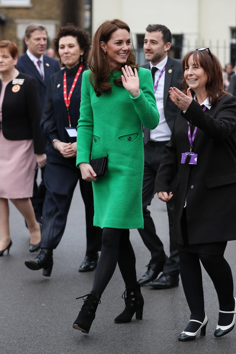 Kate brightened up a gloomy London day in a bright green, bespoke dress by Eponine London. She paired the dress with opaque tights, L.K.Bennett Marissa boots and a black clutch. Kate wore the ensemble to visit two schools in London in support of charity Place2Be. [Photo: Getty]