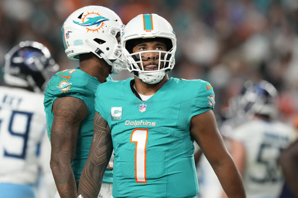 Miami Dolphins quarterback Tua Tagovailoa (1) looks up during the second half of an NFL football game against the Tennessee Titans, Monday, Dec. 11, 2023, in Miami. (AP Photo/Rebecca Blackwell)