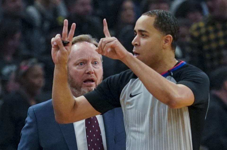 Milwaukee Bucks head coach Mike Budenholzer argues a call with referee Jonathan Sterling during the first half of an NBA basketball game against the LA Clippers Friday, Dec. 6, 2019, in Milwaukee. (AP Photo/Morry Gash)