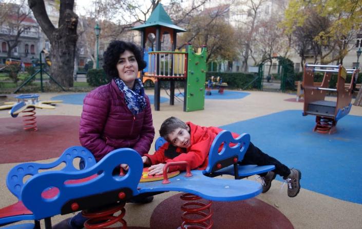 Aron's mother Eszter Harsanyi says the equipment "helps Aron a lot to mingle with able-bodied peers" (AFP Photo/Peter Kohalmi)