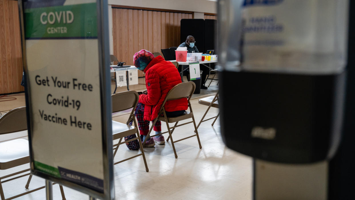 A woman fills out a registration form to receive a dose of the COVID vaccine in Washington, D.C., on March 31.