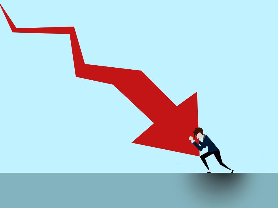 Cartoon of: Blue background with red arrow representing the economy downturn with a man carrying the drop