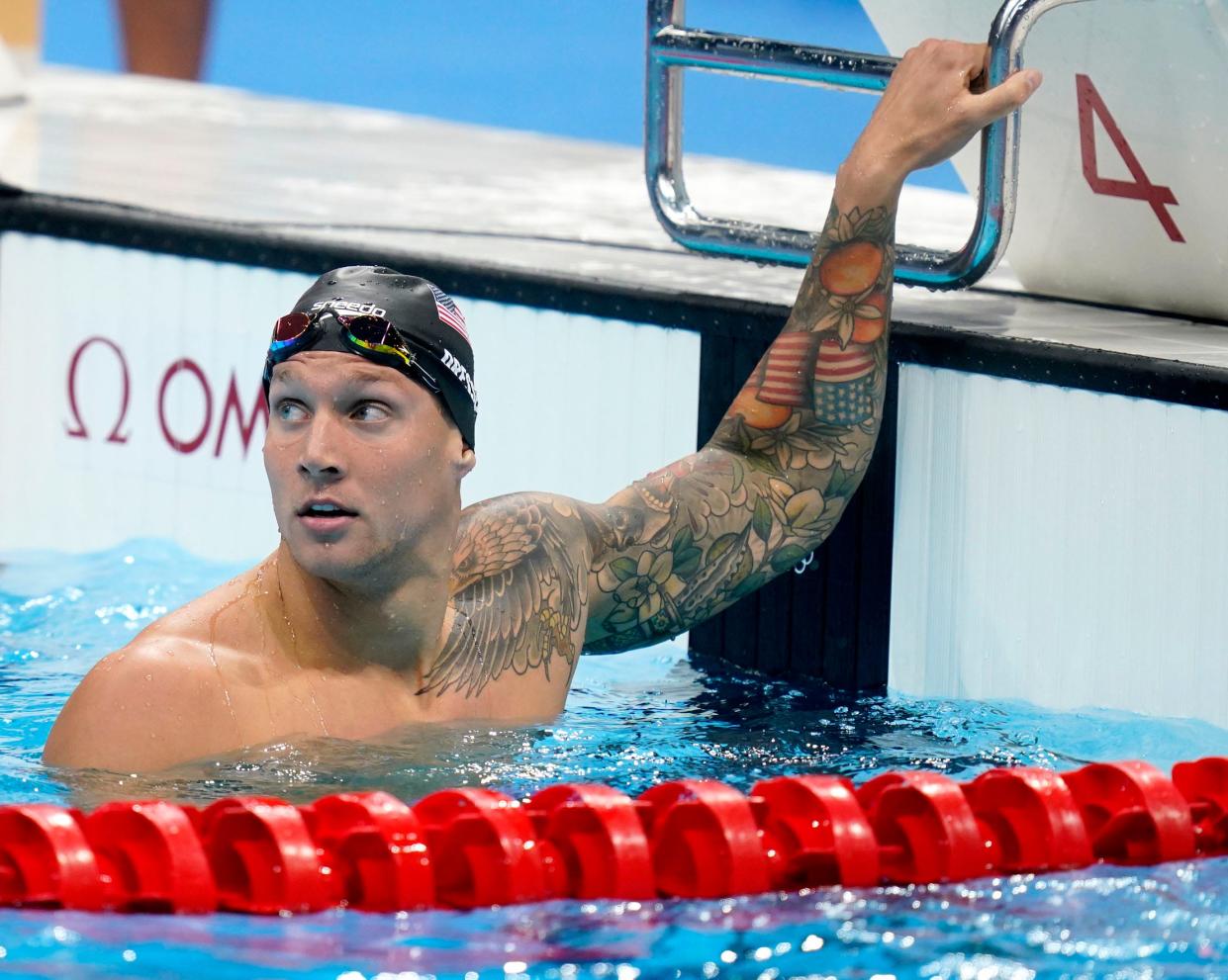 Caeleb Dressel of the United States looks up at the time board after winning the men's 100m freestyle semifinal during the Tokyo 2020 Olympic Summer Games at Tokyo Aquatics Centre on July 28, 2021. Mandatory Credit: Grace Hollars-USA TODAY Sports