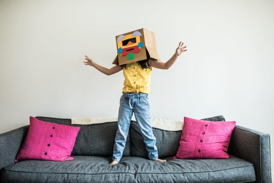 young girl wearing robot costume at home fun activities for kids