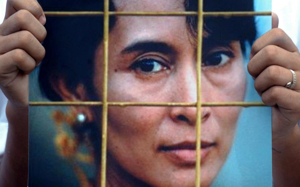 This 2009 photo shows an activist holding a portrait of Myanmar's democracy icon Aung San Suu Kyi during a protest at the Chinese embassy in Bangkok - PORNCHAI KITTIWONGSAKUL/AFP/Getty Images