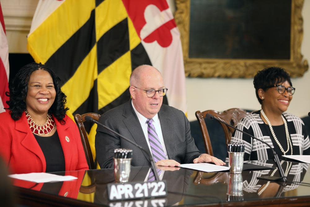 Maryland Senate President Pro Tem Melony Griffith, left, and House Speaker Adrienne Jones, right, smile at a bill-signing ceremony with Gov. Larry Hogan on April 21, 2022, in Annapolis, Md. Hogan opened his remarks at the event with Jones and Griffith by noting it was the first time two Black women were the presiding officers representing the Maryland House and Senate together at a bill signing. (AP Photo/Brian Witte, File)