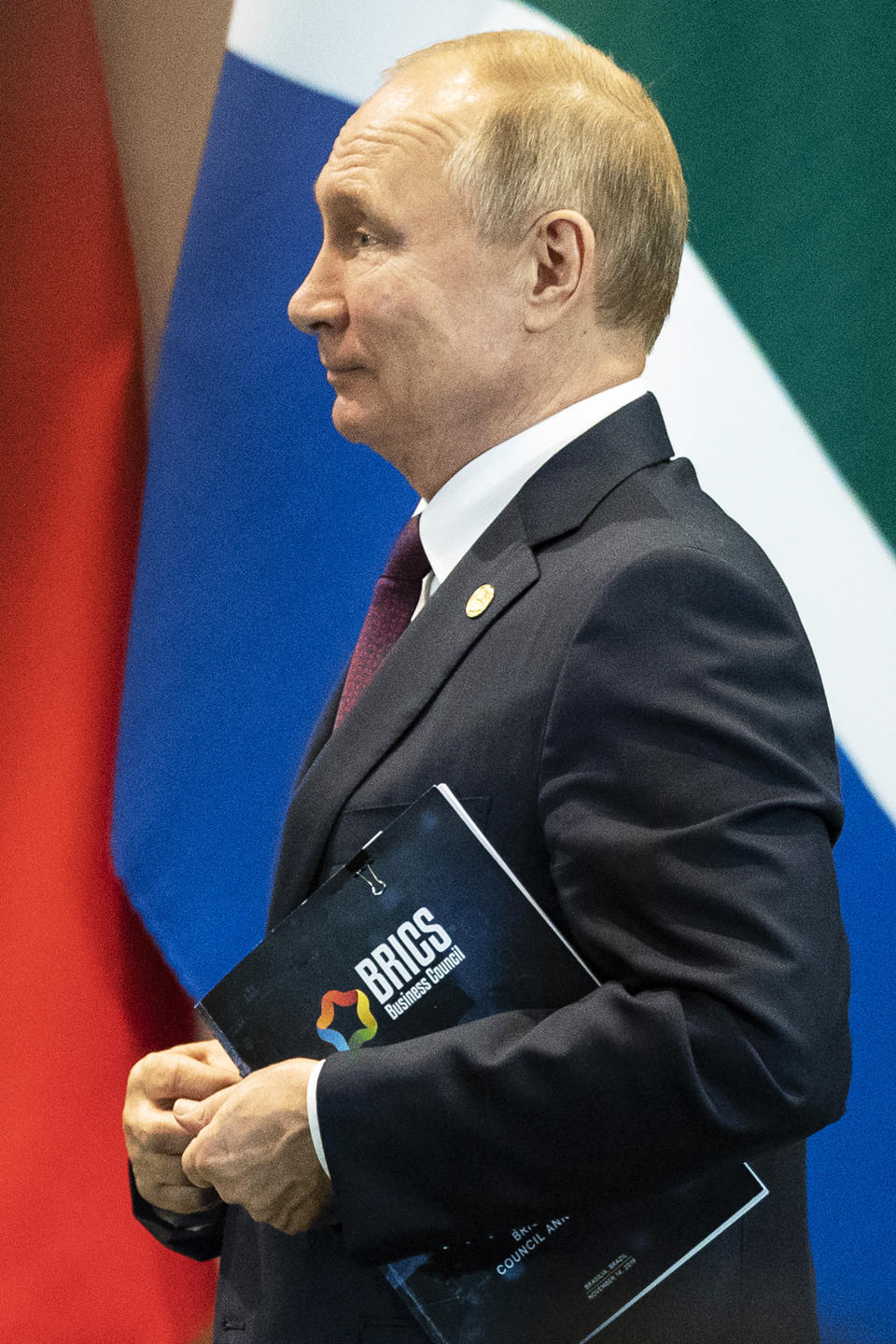 Russia's President Vladimir Putin leaves a meeting with members of the Business Council and management of the New Development Bank during the BRICS emerging economies at the Itamaraty palace in Brasilia, Brazil, Thursday, Nov. 14, 2019. (AP Photo/Pavel Golovkin, Pool)