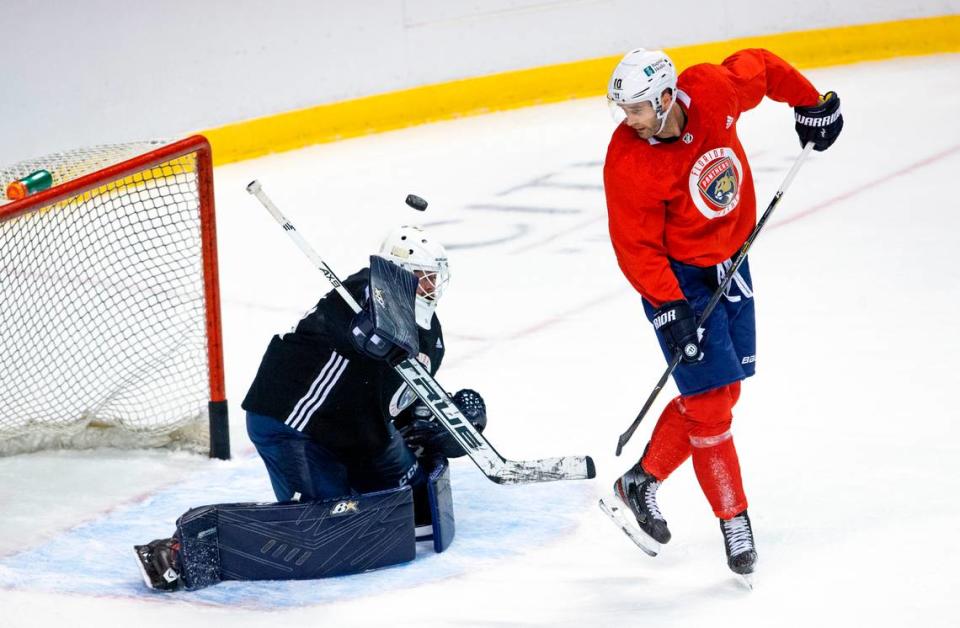 Florida Panthers goalie Scott Darling (31) blocks a shot by Panthers right wing Brett Connolly (10) during the first practice of training camp in preparation for the 2020-21 NHL season at the BB&T Center on Monday, January 4, 2021 in Sunrise.
