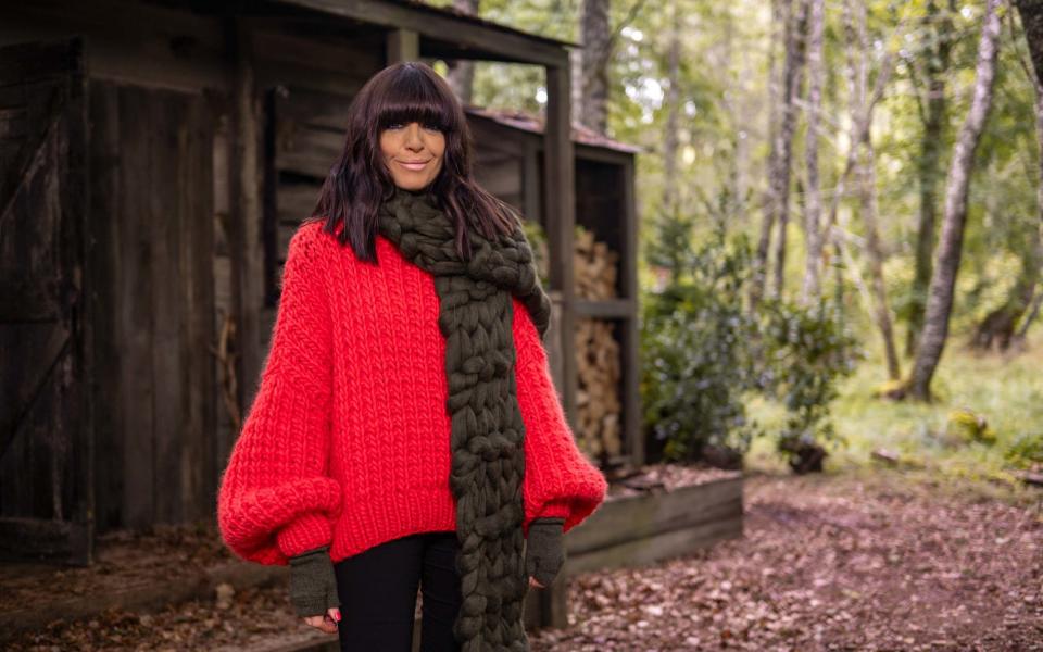 Claudia wears a jumper from Mr Mittens and a scarf from Rose and Wul