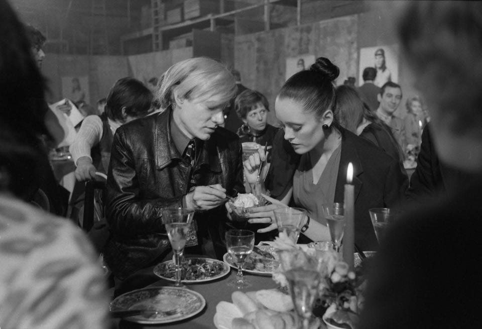 <p>The artist shares a treat with model Jane Forth at the premiere of the movie Trash in Munich, Germany.</p>
