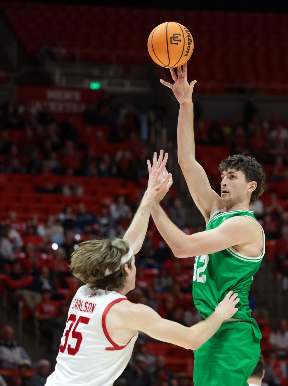 Utah Valley Wolverines center Trevin Dorius (32) shoots over Utah Utes center Branden Carlson (35) at the Huntsman Center in Salt Lake City on Saturday, Dec. 16, 2023. | Spenser Heaps, Deseret News