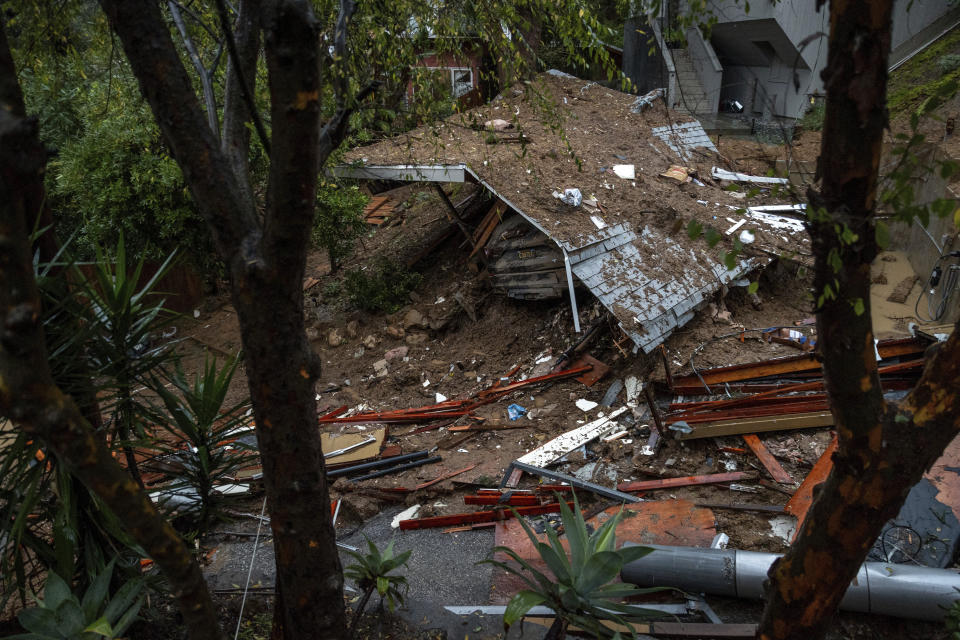 A property sits destroyed by a mudslide during a storm, Tuesday, Feb. 6, 2024, in the Beverly Glen area of Los Angeles. (AP Photo/Ethan Swope)