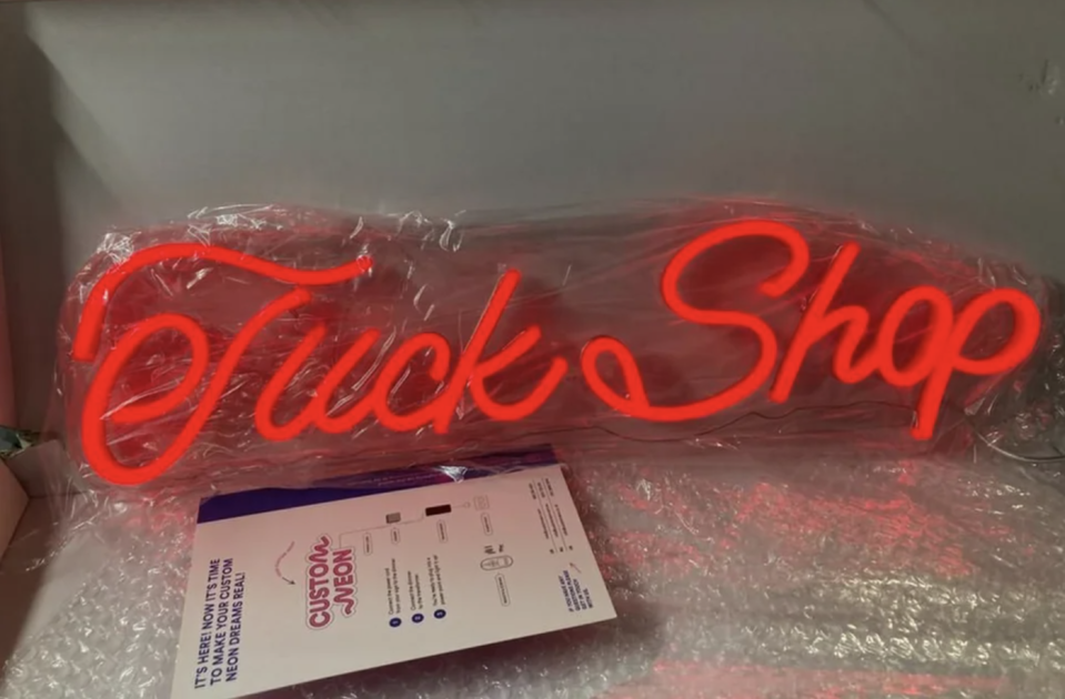 Neon "tuck shop" sign