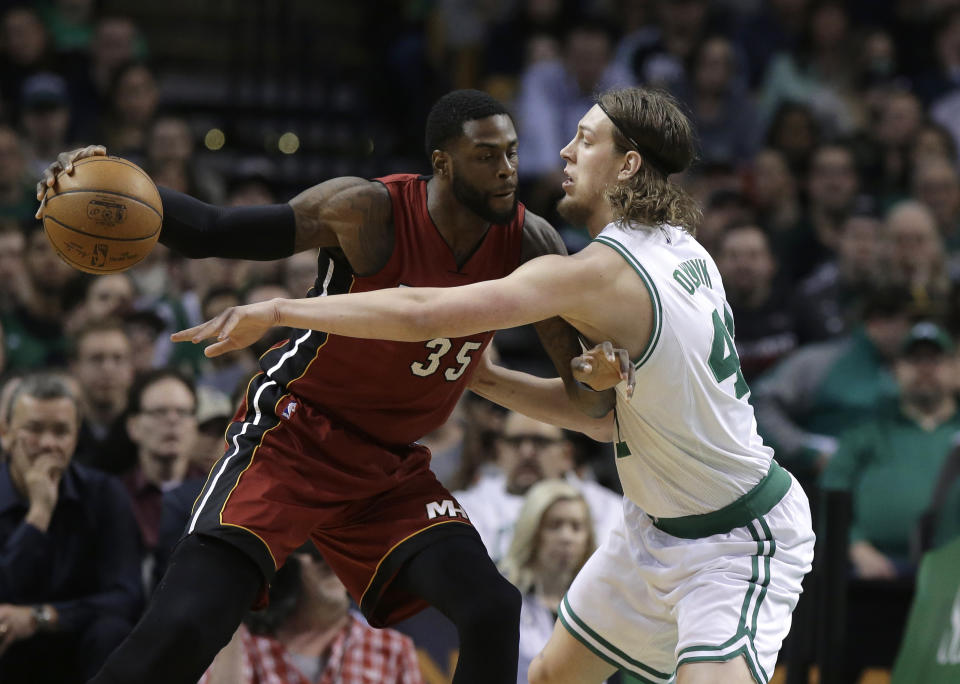 Willie Reed, then of the Miami Heat, tries to score against Kelly Olynyk, then of the Boston Celtics. (AP)