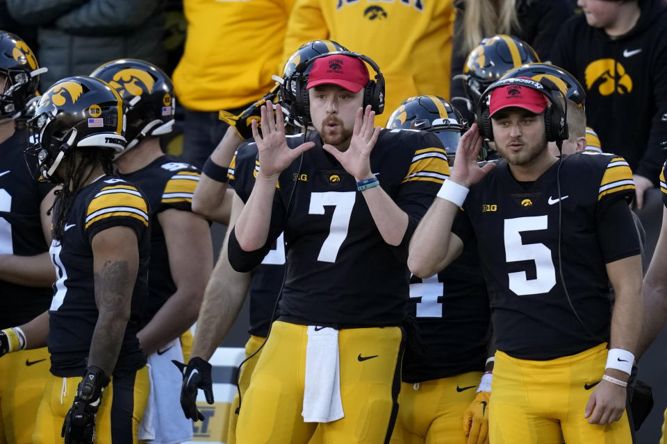 Iowa quarterback Spencer Petras (7) signals a play during the first half of an NCAA college football game against Nebraska, Friday, Nov. 25, 2022, in Iowa City, Iowa. (AP Photo/Charlie Neibergall)