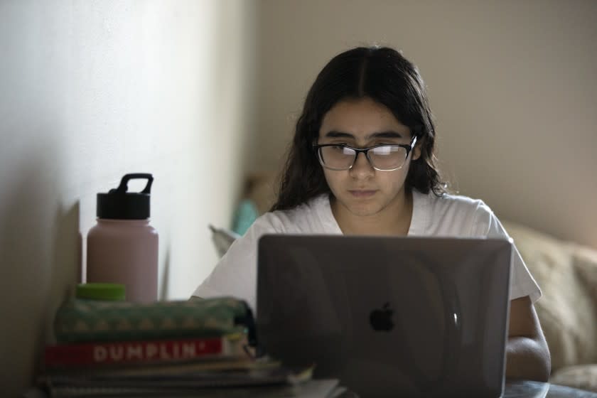 LA PUENTE, CA - APRIL 08: Amanda Alarcon works on her economics homework. She is a senior at Los Angeles High School who won admission to both UCLA and UC Berkeley. Record applications to the University of California have made this one of the toughest admissions seasons ever. Photographed on Thursday, April 8, 2021 in La Puente, CA. (Myung J. Chun / Los Angeles Times)