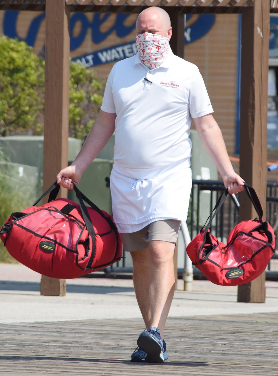 A man wearing a mask in Rehoboth on July 4, 2020.