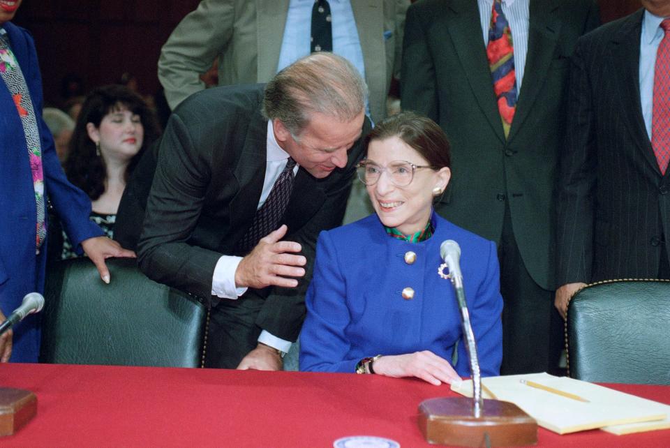 Sen. Joe Biden, D-Del., chairman of the Senate Judiciary Committee, talks to Supreme Court nominee Ruth Bader Ginsburg at her confirmation hearing in 1993 .