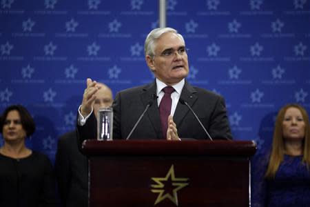 Panama Canal Administrator Jorge Quijano gestures as he speaks during a news conference in Panama City February 28, 2014. REUTERS/Carlos Jasso