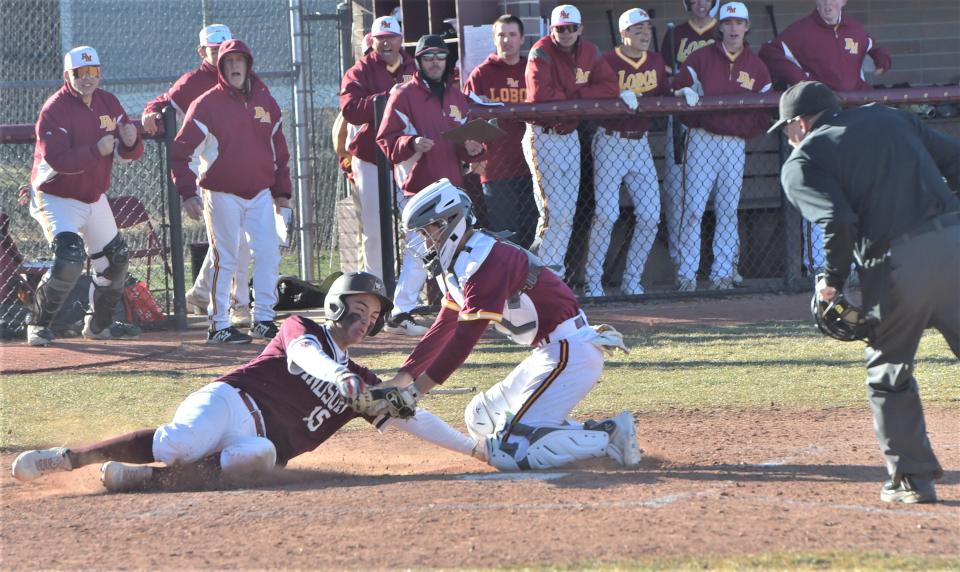 Windsor High School baseball player Ethan Fillinger slides into home plate during a game against Rocky Mountain in Fort Collins on March 23, 2022.