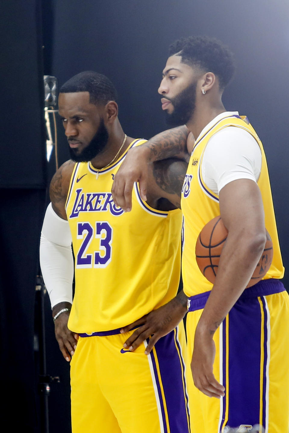 Los Angeles Lakers forwards LeBron James, leftt, and Anthony Davis, right, pose for photos during the NBA basketball team's media day in El Segundo, Calif., Friday, Sept. 27, 2019. (AP Photo/Ringo H.W. Chiu)