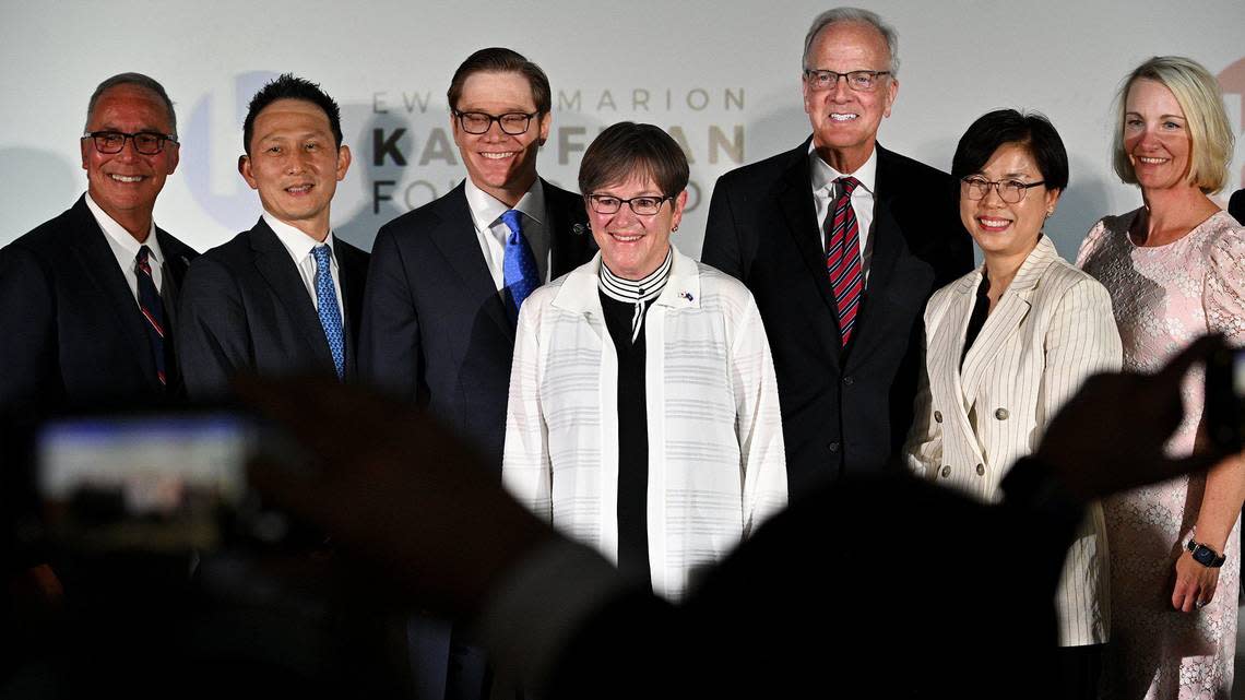 After Kansas Gov. Laura Kelly (center) announced plans to build a $4 billion Panasonic EV battery plant near De Soto,Tim Cowden (from left), president and CEO of KCADC; Kris Takamoto, executive vice president of Panasonic Energy; Kansas Lt. Gov. David Toland; U.S. Sen. Jerry Moran; Megan Myungwon Lee, chairwoman and CEO of Panasonic Corporation of North America; and Carli Kinne, general counsel for Panasonic, posed for a photo.