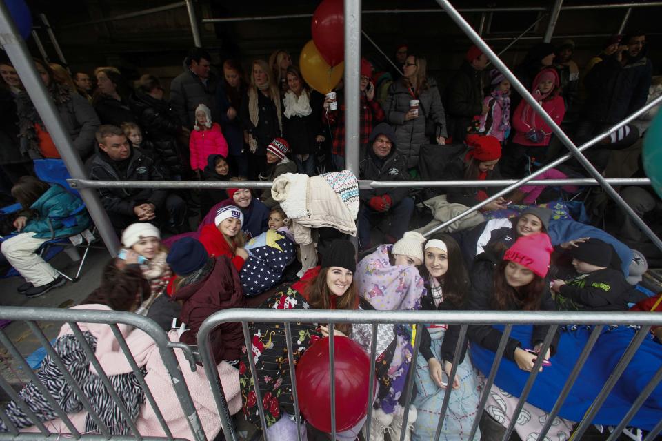 People wait the start of the Macy's Thanksgiving Day Parade in New York