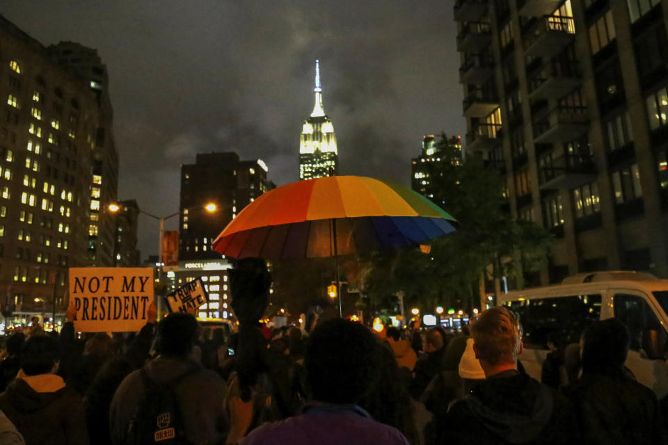 The Empire State Building is seen in the background as demonstrators take part in a protest march against President-elect Donald Trump in Manhattan, New York, U.S. November 9, 2016. REUTERS/Bria Webb