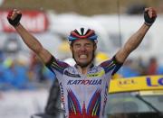 Katusha rider Joaquim Rodriguez of Spain celebrates as he crosses the finish line to win the 195-km (121.16 miles) 12th stage of the 102nd Tour de France cycling race from Lannemezan to Plateau de Beille, in the French Pyrenees mountains, France, July 16, 2015. REUTERS/Eric Gaillard