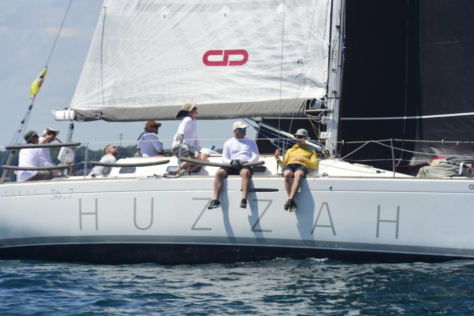 Crew members on Huzzah, captained by Greg Chamberlain, during the start of the Bayview Mackinac Race in Port Huron on Saturday, July 16, 2022.