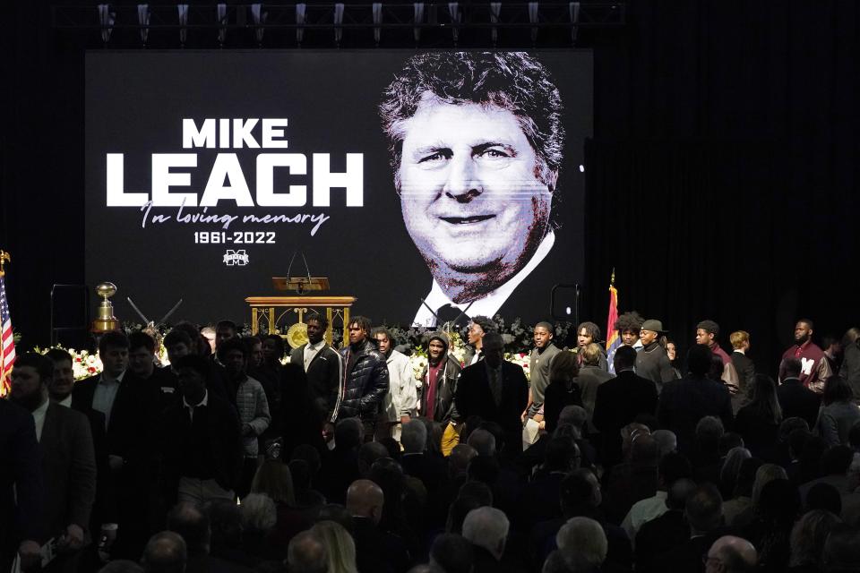 Current football players enter the memorial service for their late Mississippi State football coach Mike Leach, at Humphrey Coliseum on the university’s campus in Starkville, Miss., Tuesday, Dec. 20, 2022. Leach died, Dec. 12, 2022, from complications related to a heart condition at 61. He was in his third year as head coach. | Rogelio V. Solis, Associated Press