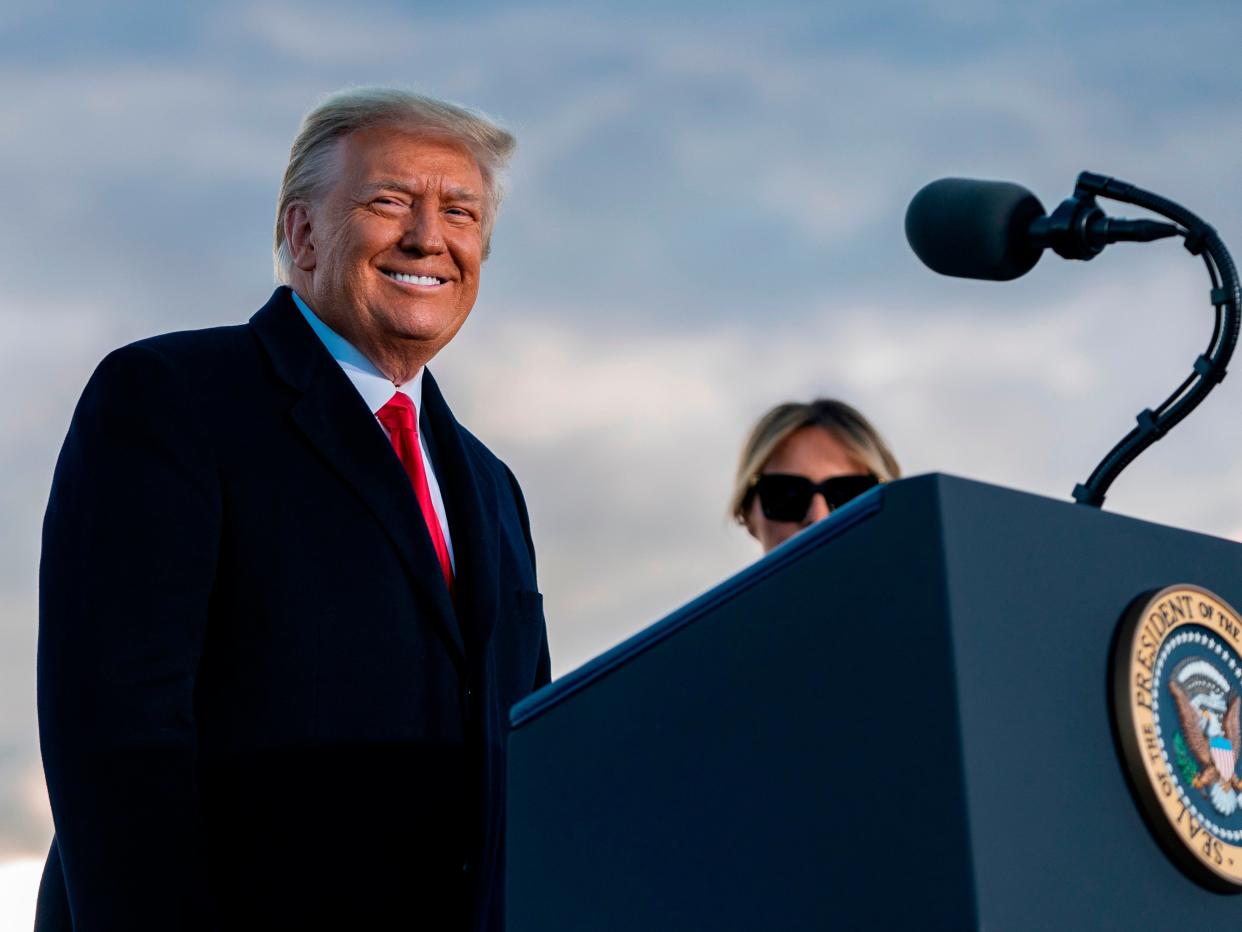 <p>Outgoing US President Donald Trump and First Lady Melania Trump address guests at Joint Base Andrews in Maryland </p> ((AFP via Getty Images))